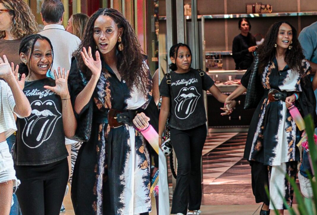 Tais Araujo e a filha, Maria Antônia, acenam para paparazzo em dia de compras